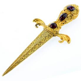 victorial yellow gold with blood red garnet handle and Damascus steel blade